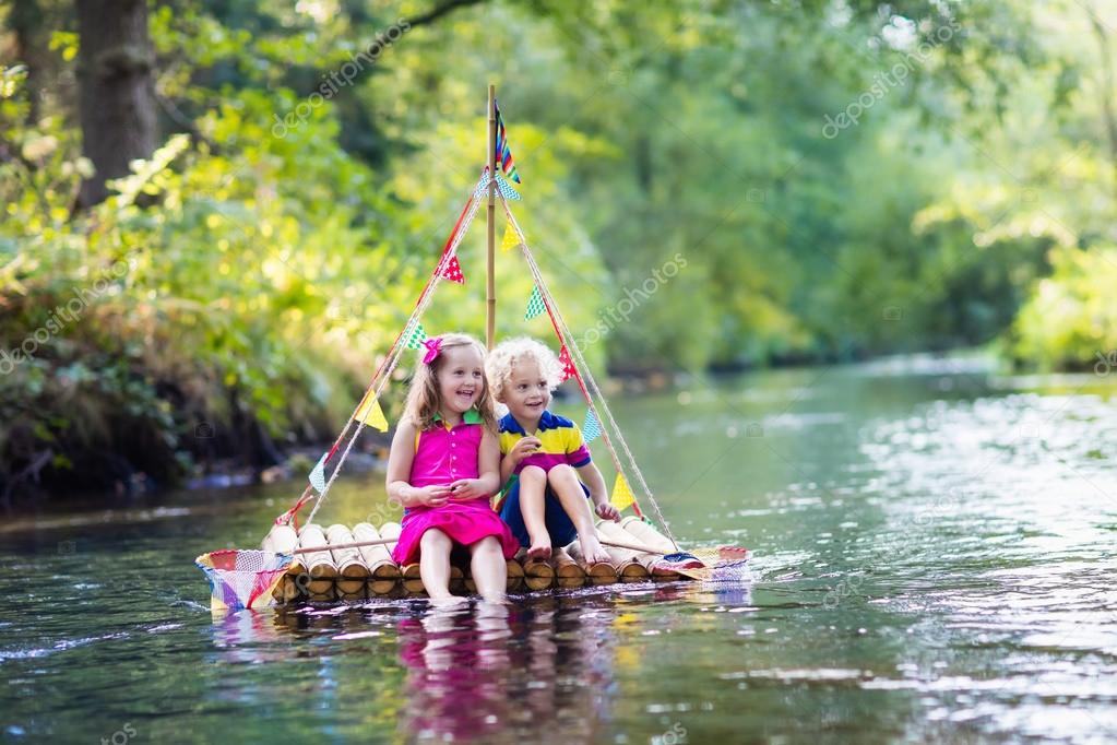 Kids on wooden raft — Stock Photo © FamVeldman 123529574