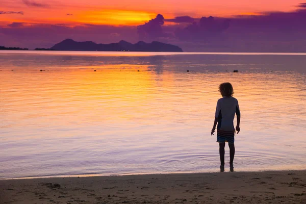 Child Playing Ocean Beach Kid Jumping Waves Sunset Sea Vacation — Stock Photo, Image