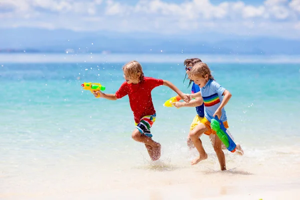 Child Playing Toy Water Gun Vacation Beach Fun Kids Run — Stock Photo, Image