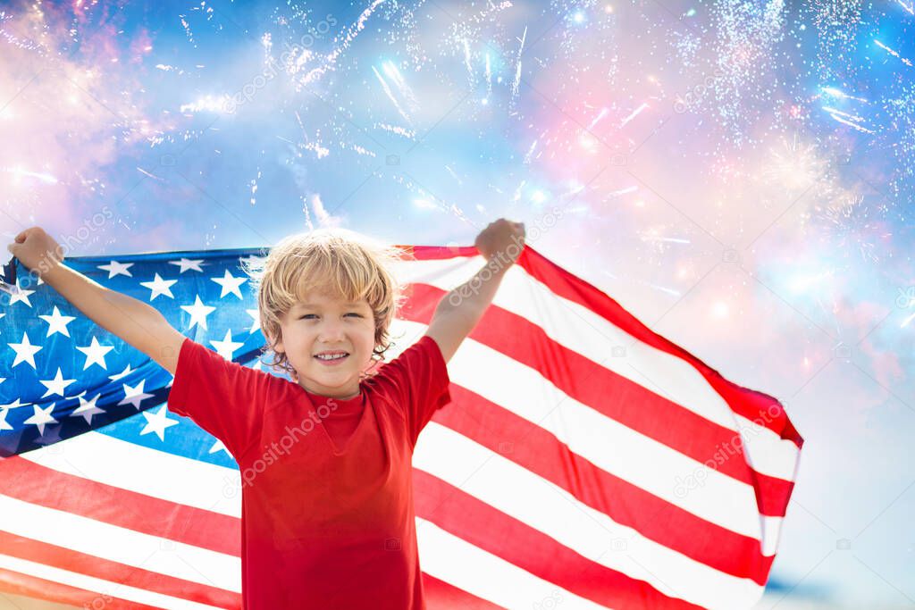 Kids run with USA flag on sunny beach. 4th of July celebration. American family fun on Independence Day weekend. Patriotic children celebrate US holiday. Boy and girl with symbols of America.