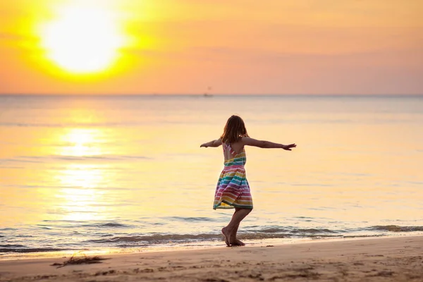 Child Playing Ocean Beach Kid Jumping Waves Sunset Sea Vacation — Stock Photo, Image