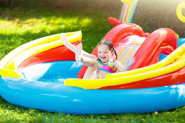 Child Playing Inflatable Baby Pool Kids Swim Slide Splash Colorful — Stock Photo, Image