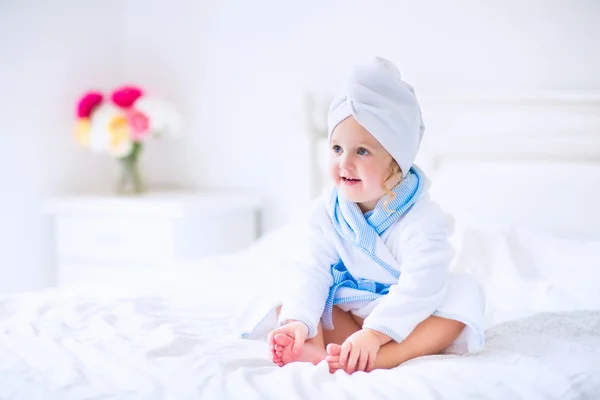 Litlte girl in a bathrobe and towel — Stock Photo, Image