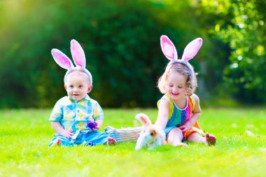 Children at Easter egg hunt clipart