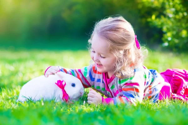 Little girl and real rabbit — Stock Photo, Image