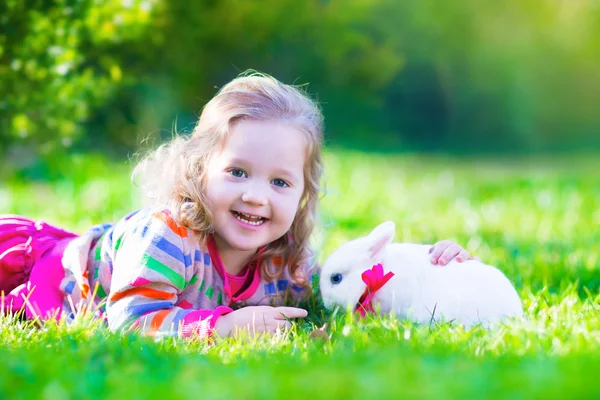 Little girl and real rabbit — Stock Photo, Image