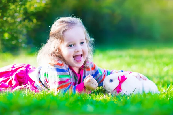 Little girl and real rabbit — Stock Photo, Image