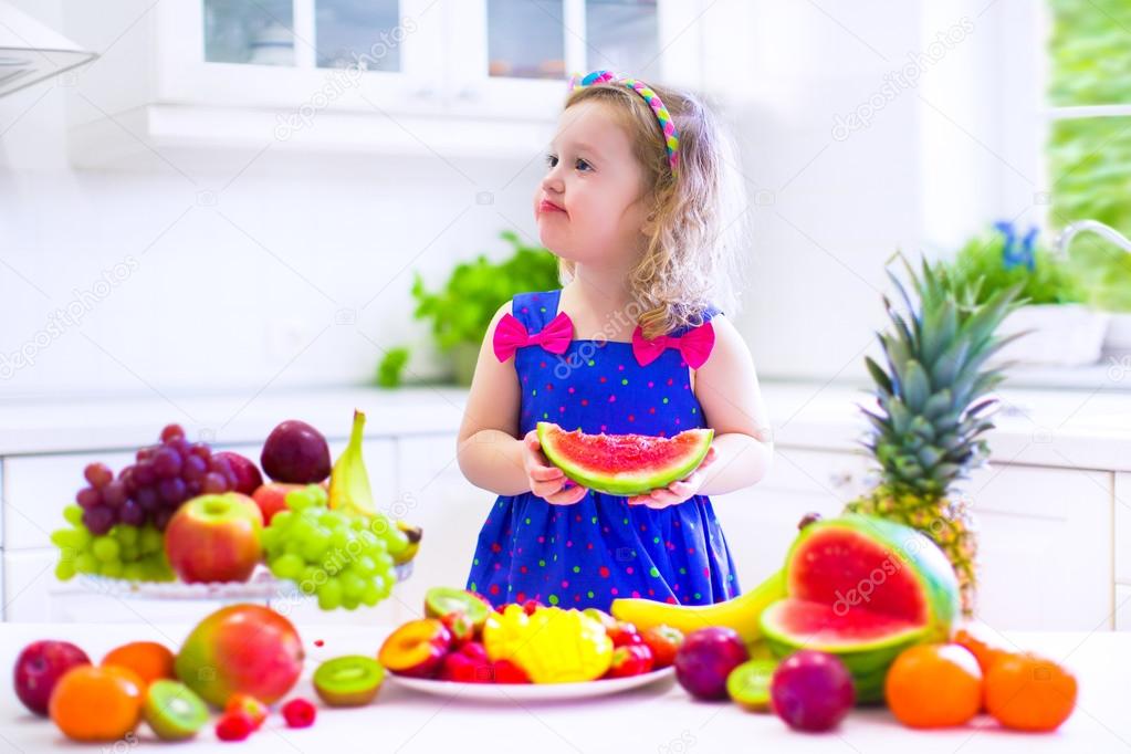 Little girl eating water melon