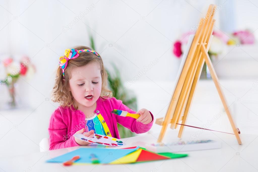 Little girl painting