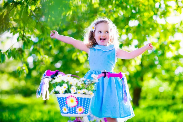 Little girl riding a bike — Stock Photo, Image