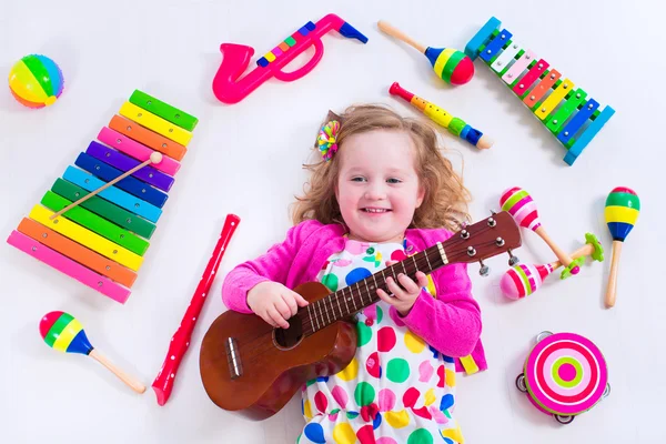 Menina com instrumentos de música — Fotografia de Stock