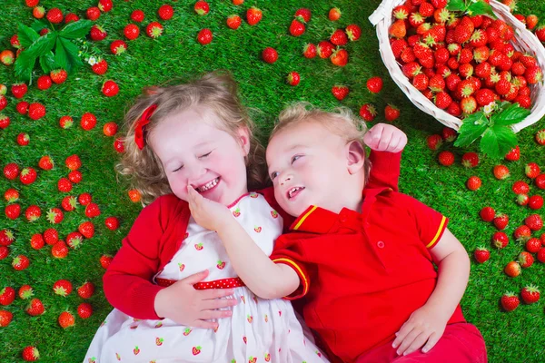 Children eating strawberry