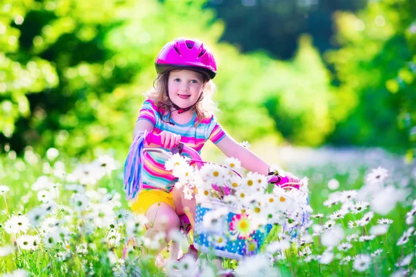 Little girl riding a bike — Stock Photo, Image