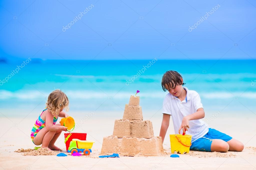 Kids building sand castle on the beach