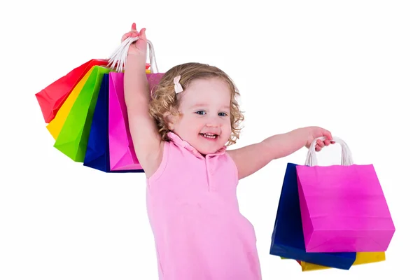 शॉपिंग पिशव्या लहान मुलगी — स्टॉक फोटो, इमेज