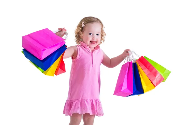 Niña con bolsas de compras Imágenes de stock libres de derechos