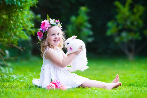 Cute girl playing with real bunny — Stock Photo, Image