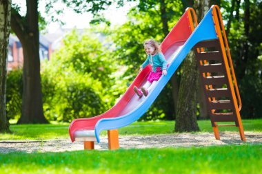 Little girl on a playground clipart