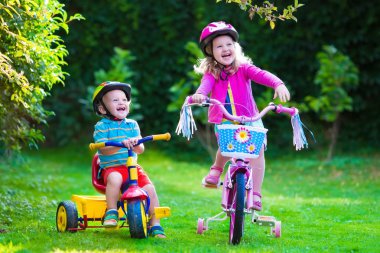 Two children riding bikes