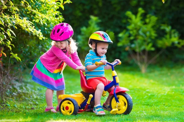 Two children riding bikes — Stok fotoğraf