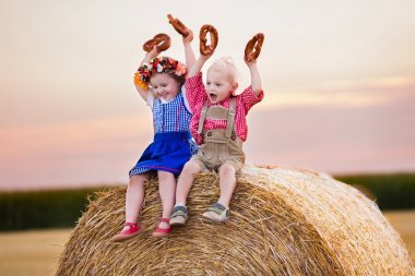 Kids playing in wheat field in Germany clipart