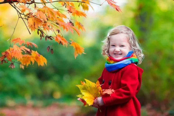 Little girl with yellow autumn leaf — Stock Photo, Image