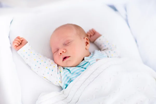 Cute newborn baby in white bed — Stock Photo, Image