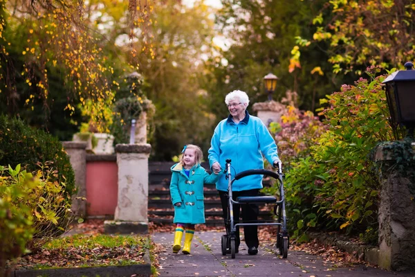 Senior lady with walker enjoying family visit — Stock Photo, Image