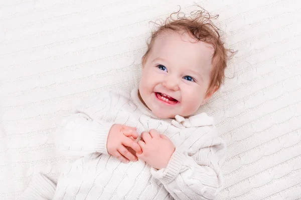 Baby girl on knitted blanket — Stock Photo, Image