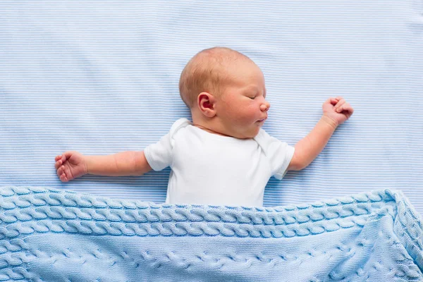 Newborn baby boy on a blue blanket — Stock Photo, Image