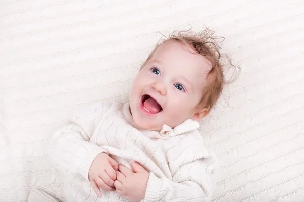 Baby girl on knitted blanket — Stock Photo, Image