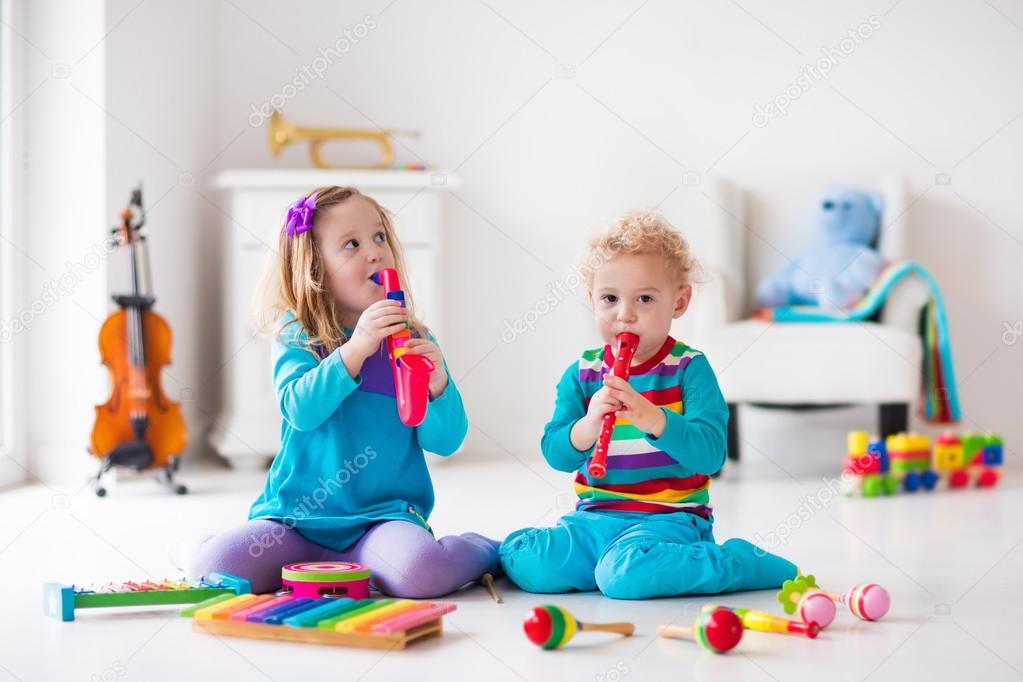 Boy and girl playing flute