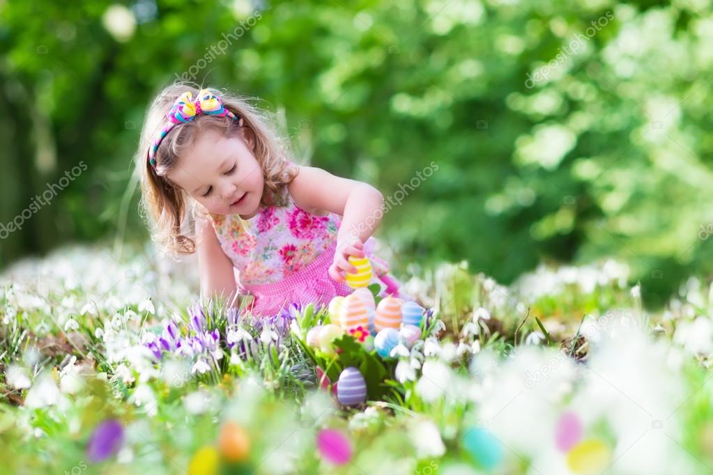 Little girl on Easter egg hunt