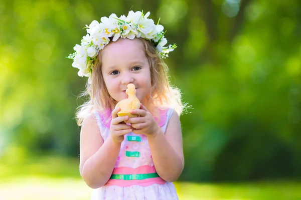 Little girl playing with a toy duck — Stock Photo, Image