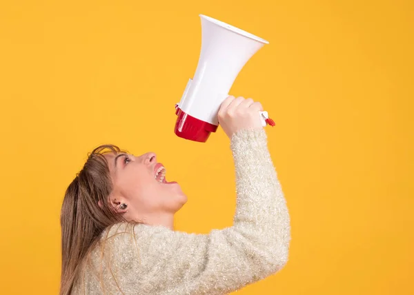 woman with a megaphone yelling, yellow background