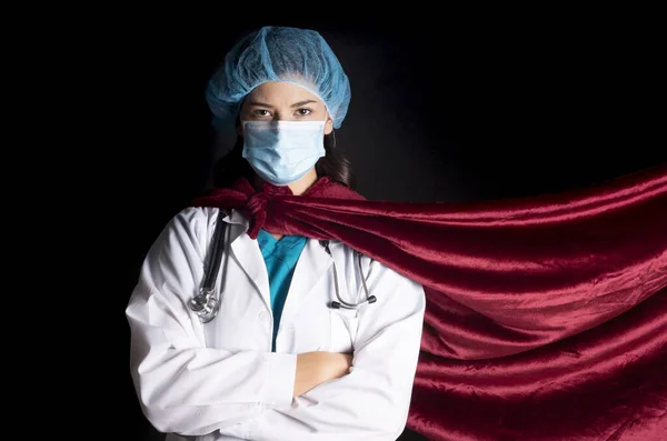 female doctor with mask and red cape