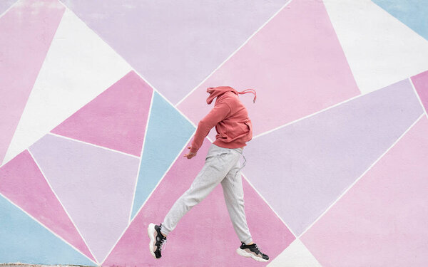 happy woman jumping with music on nice background