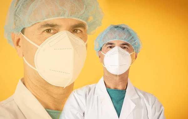 A sad senior mature age surgeon doctor on yellow background