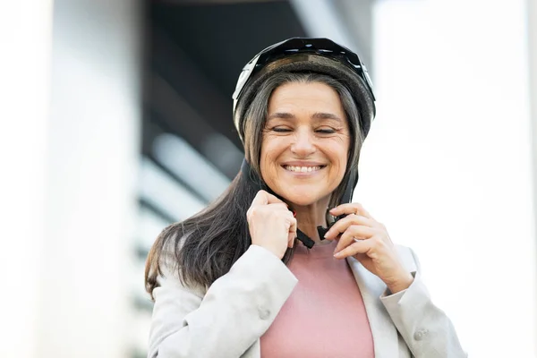 mature woman helmet bike city