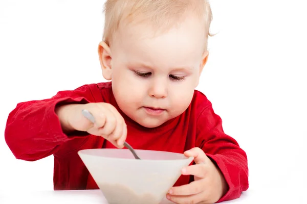 Little baby eating with spoon — Stock Photo, Image