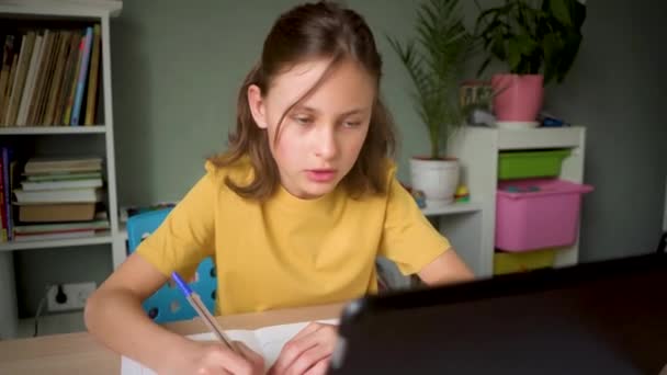 Cute child use laptop for education, online study, home studying. Girl have homework at home schooling. — Stock Video