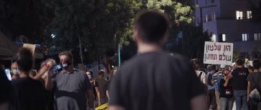 Jerusalem, Israel - August 29, 2020: People walking towards the square in central Jerusalem, to protest against the current government in israel.