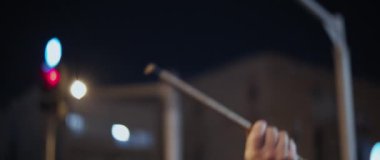 Jerusalem, Israel - August 29, 2020: A man making noise during a night protest against the government.