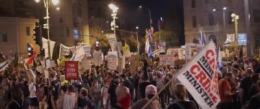 Jerusalem, Israel - August 29, 2020: People waving flags and posters in hebrew, protesting against the current government in Jerusalem.