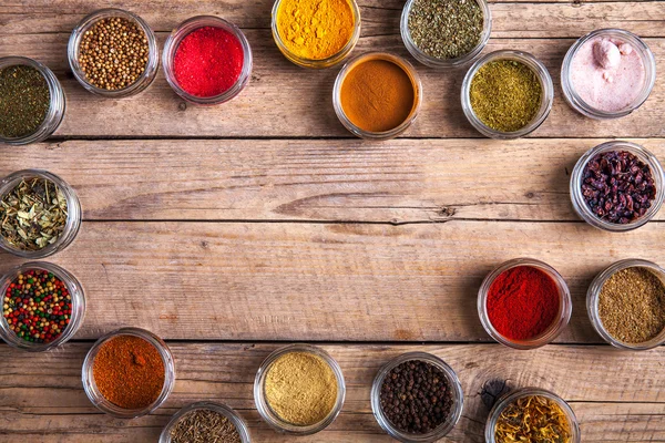 Spices in jars on wooden background. Food — Stock Photo, Image