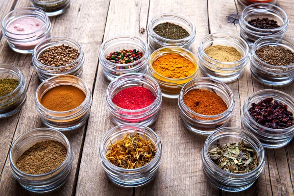 Spices in jars on wooden background. Food — Stock Photo, Image