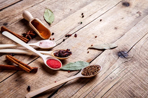 Spices on wooden background. With empty space for advertising text — Stock Photo, Image