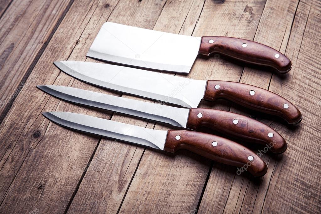 Beautiful knives with wooden handle, on an old table. Kitchen, c Stock
