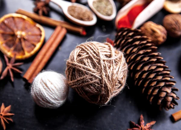 Wooden spoons with spices on black background — Stock Photo, Image