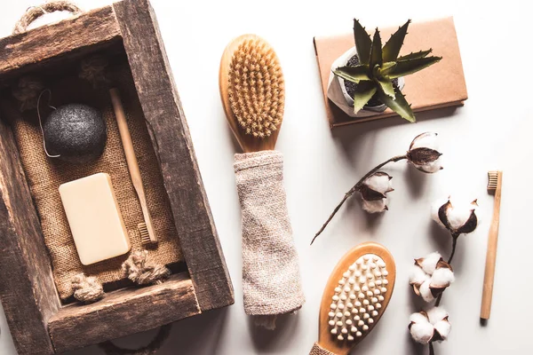 Natural brushes made of wood and soap on the background of concrete, bamboo toothbrushes PNOV2019 — Stock Photo, Image